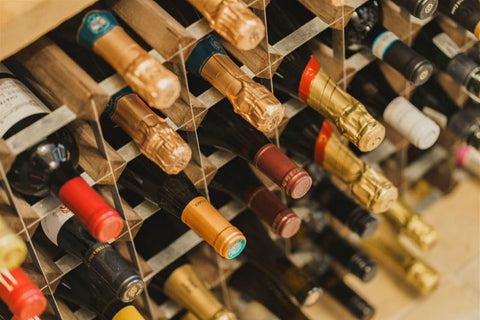 Wine bottles arranged in a wooden rack